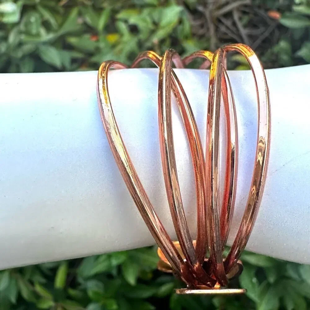 Rose gold tone twisted open cuff bracelet